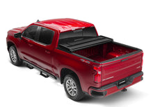 Load image into Gallery viewer, Lund 04-15 Nissan Titan (5.5ft. Bed) Hard Fold Tonneau Cover w/Bracket Kit - Black