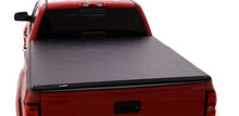 Load image into Gallery viewer, Lund 04-15 Nissan Titan (5.5ft. Bed) Hard Fold Tonneau Cover w/Bracket Kit - Black