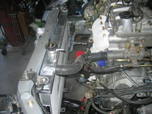 Load image into Gallery viewer, Mishimoto 01-03 Mazda Protege Manual Aluminum Radiator **Requires Modification**